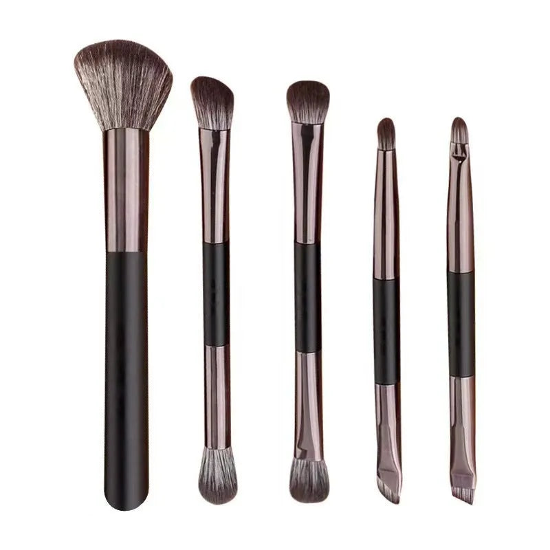 Makeup brush set with mirror showing plastic handles and artificial fibre bristles