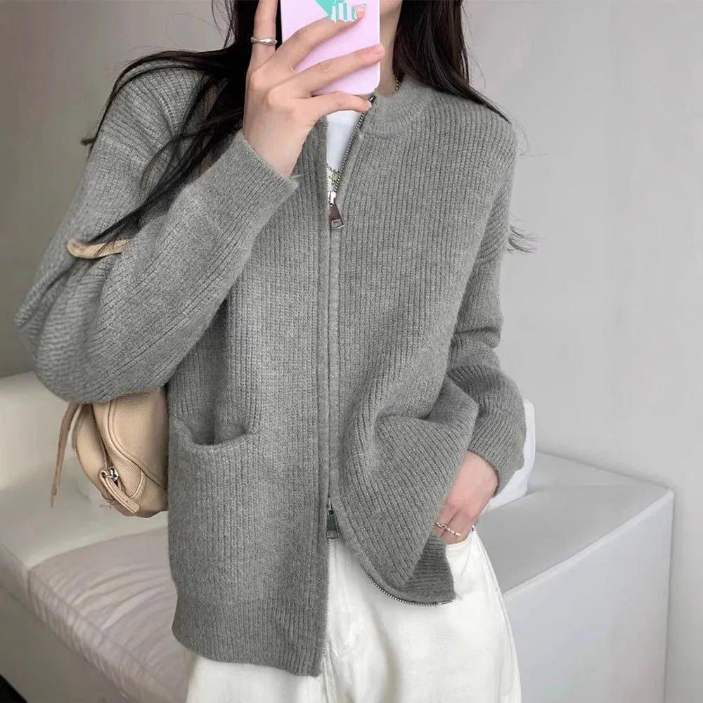 Beige viscose soft sweater coat cardigan with long sleeves on a hanger