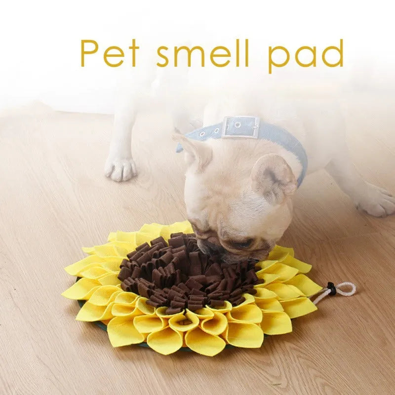 Yellow sunflower-shaped dog snuffle mat with fleece surface and a rope for hanging