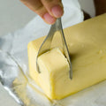 Stainless steel butter cutter with 12cm 304 stainless steel edged blade on a kitchen surface