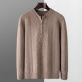 Man wearing a beige pure wool diamond pattern half-zip sweater with a loose fit.