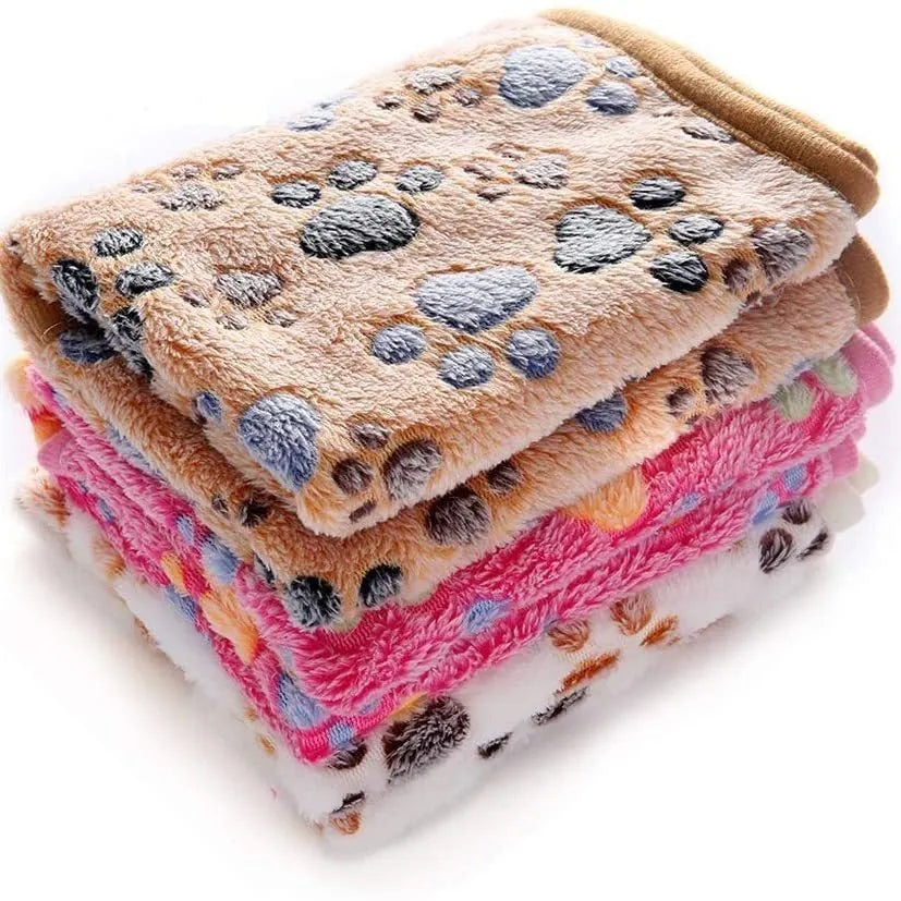 Coral fleece pet blanket with dog paw print design in multiple size options
