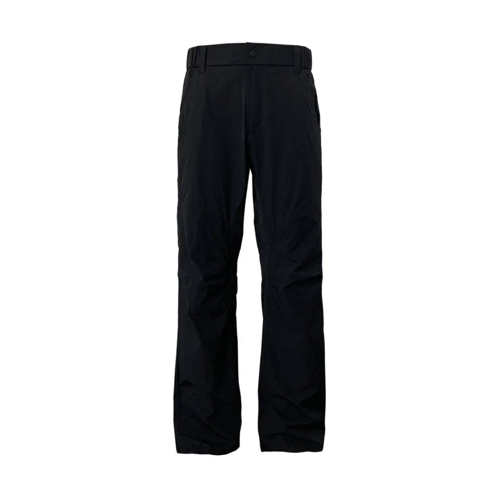 Man wearing grey 3D cut deconstructed casual trousers with a straight leg and elasticated waist.