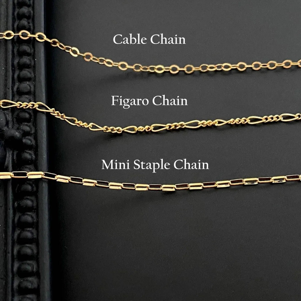 A modern ghost pendant necklace on a stainless steel chain, showing the titanium steel electroplated pendant detail.