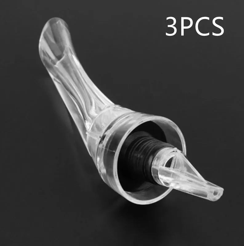 Compact clear acrylic wine aerator with a stainless steel filter, measuring 16cm long.