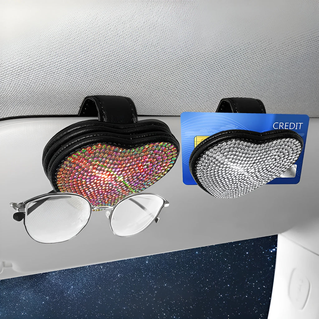 Black diamond-encrusted PU leather clip holding sunglasses and a ticket on a car sun visor.