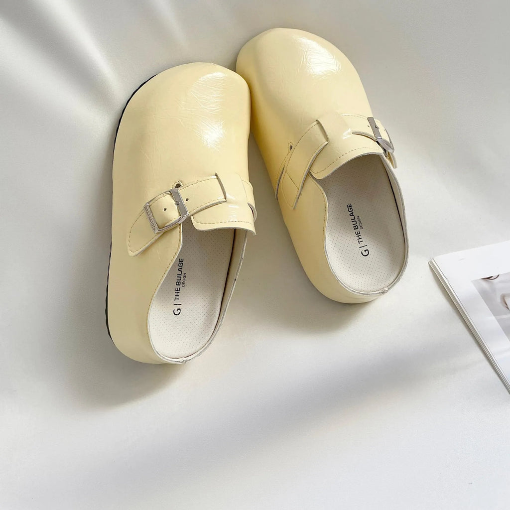 Flat buckle casual sneakers in yellow colour with round toe and PU upper material
