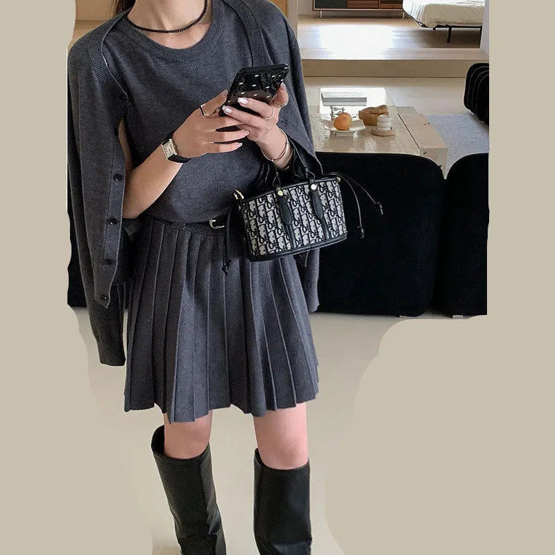 Grey art retro knitted two-piece set with 3D pattern, featuring a pleated vest skirt and long-sleeved cardigan with an adjustable belt.