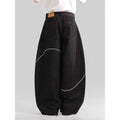 Black straight-leg denim trousers with a mid-waist fit and micro-elastic waistband on a hanger.