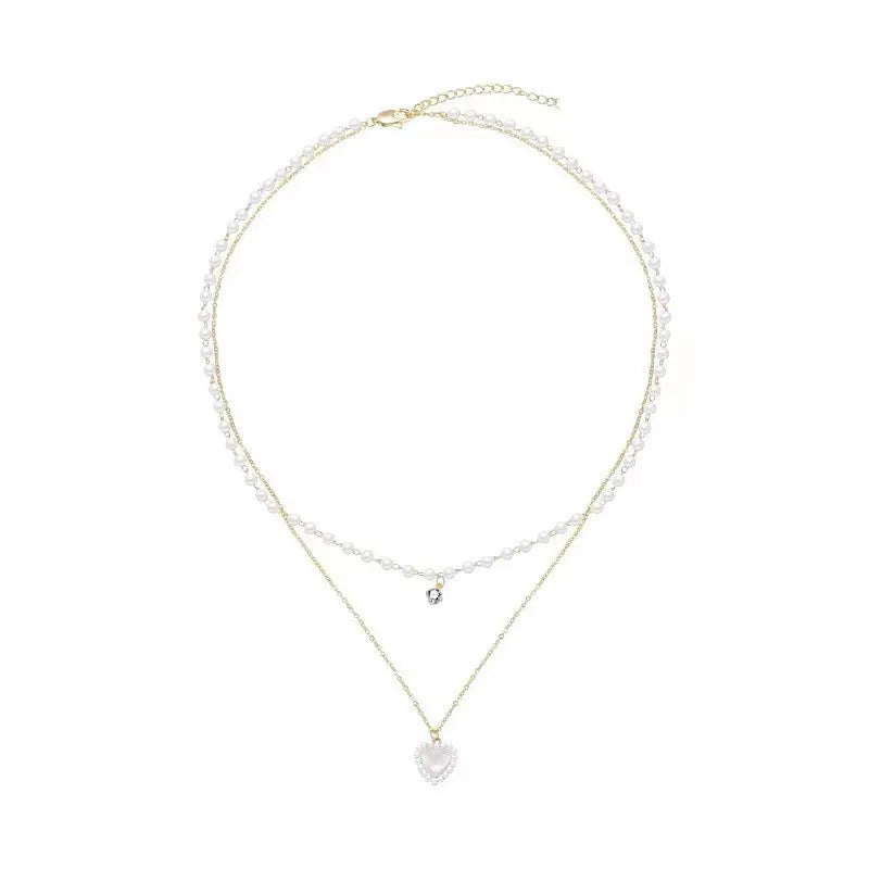 Gold-tone zinc alloy double-layer necklace with heart-shaped pendant and adjustable 21-50cm regular chain for women.