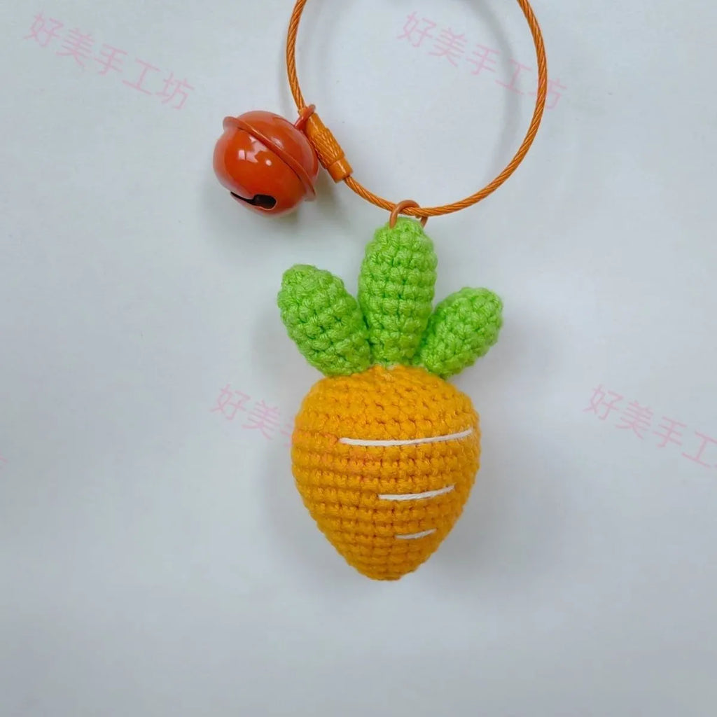 Soft wool keychain pendant shaped like a cartoon carrot car on a keyring.