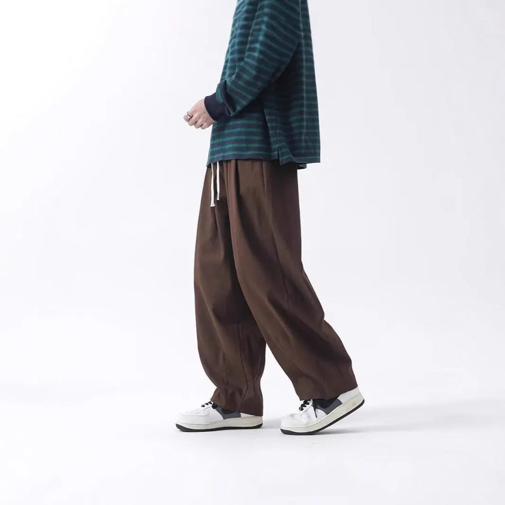 Cotton men's loose wide leg drawstring trousers in black and brown straight leg style with mid waist