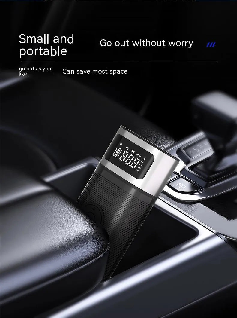 Black portable wireless vehicle air pump with metal construction and 15cm inflation tube including multiple nozzle attachments
