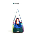 Foldable polyester tote bag in orange, green, and purple, with crossbody option