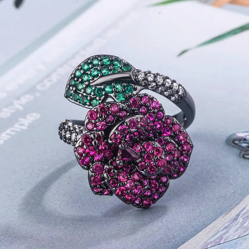 Geometric black gold ring with simulated red corundum stones on gold-plated copper band