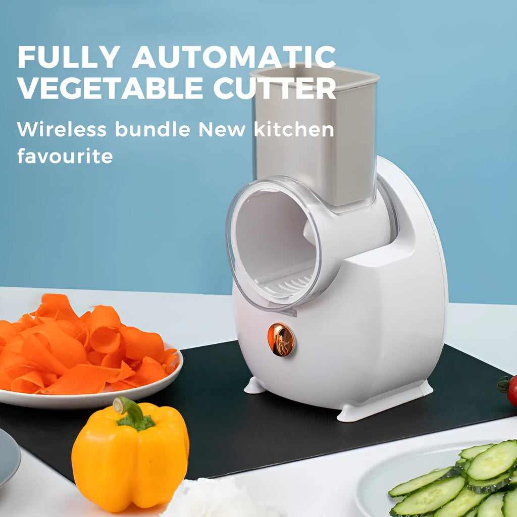 White electric vegetable slicer with rotary grater, blade barrel, and suction base on a kitchen counter.