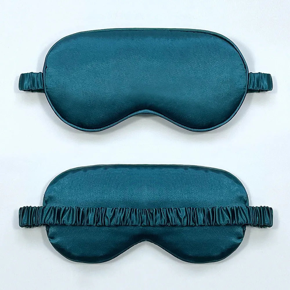 Rayon satin double-sided sleep mask in a selection of solid colours on a white background.