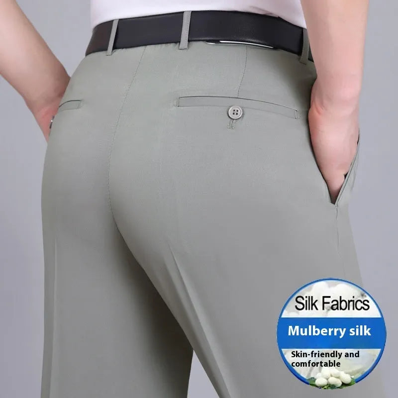 Men's straight-leg mulberry silk blend business trousers in dark blue on a hanger.