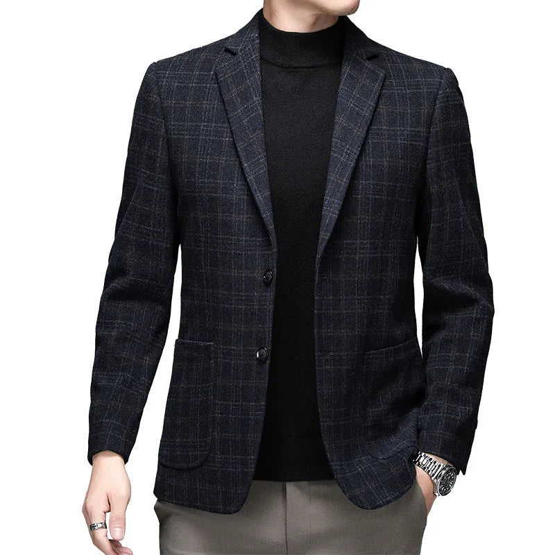 A man wearing a solid-colour loose-fit casual wool-style jacket with a round hem and long sleeves.