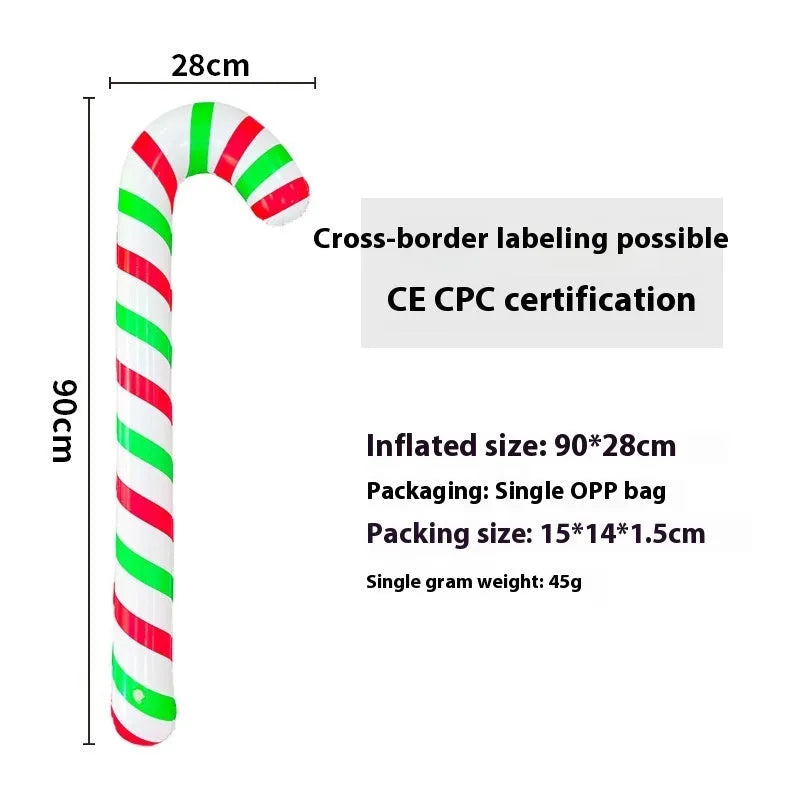 Large red and white inflatable Christmas ball with flashing lights standing in a garden.