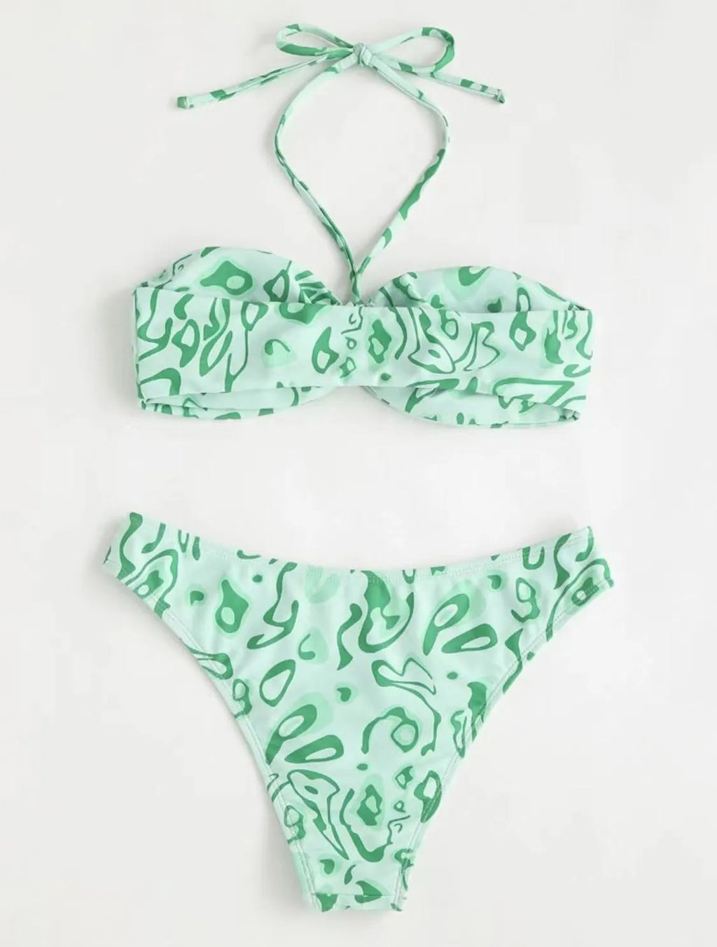Green floral bandeau bikini swimsuit with split design and adjustable straps on mannequin