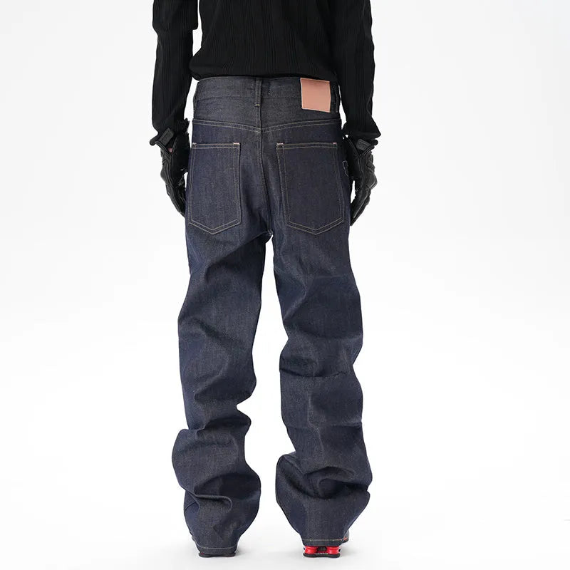Man's dark blue loose straight-leg casual jeans on a white background.