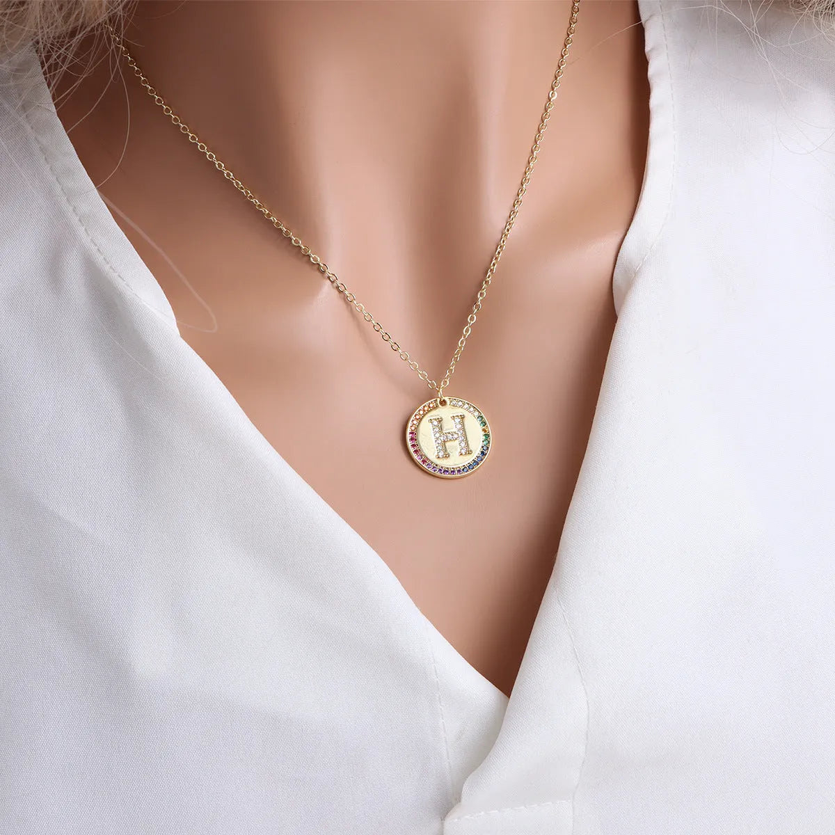 Gold English letter round pendant necklace with colourful crystals on clavicle length chain