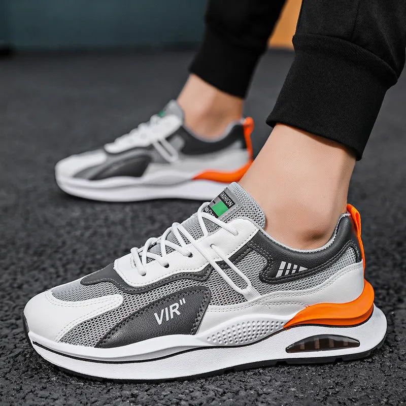Men's grey breathable mesh running shoes with a round toe and EVA sole on a white background