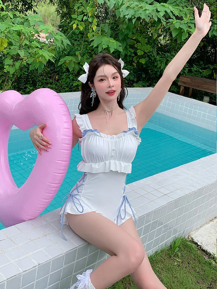 Women's Milky White backless nylon one-piece swimsuit on hanger