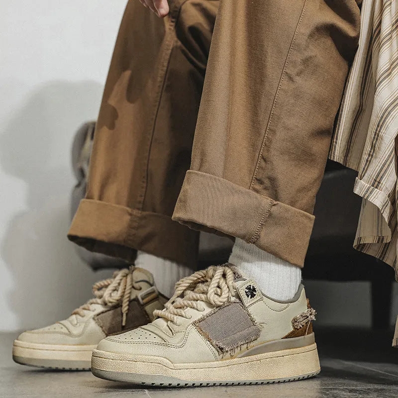 Beige low-top vintage skateboard shoes with microfiber upper and flat rubber sole.