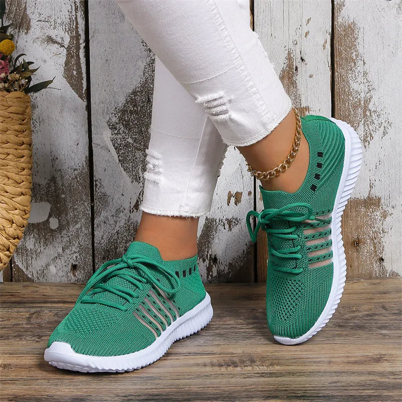 Beige lace-up mesh sneakers with round toe, rubber sole, and PU insole on a flat surface