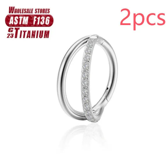Titanium alloy fork nose ring in silver colour on a grey background