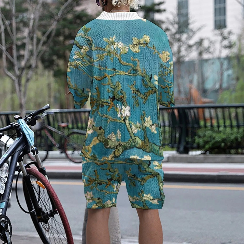 Men's peacock blue knitted casual shorts suit with T-shirt top on a plain background.