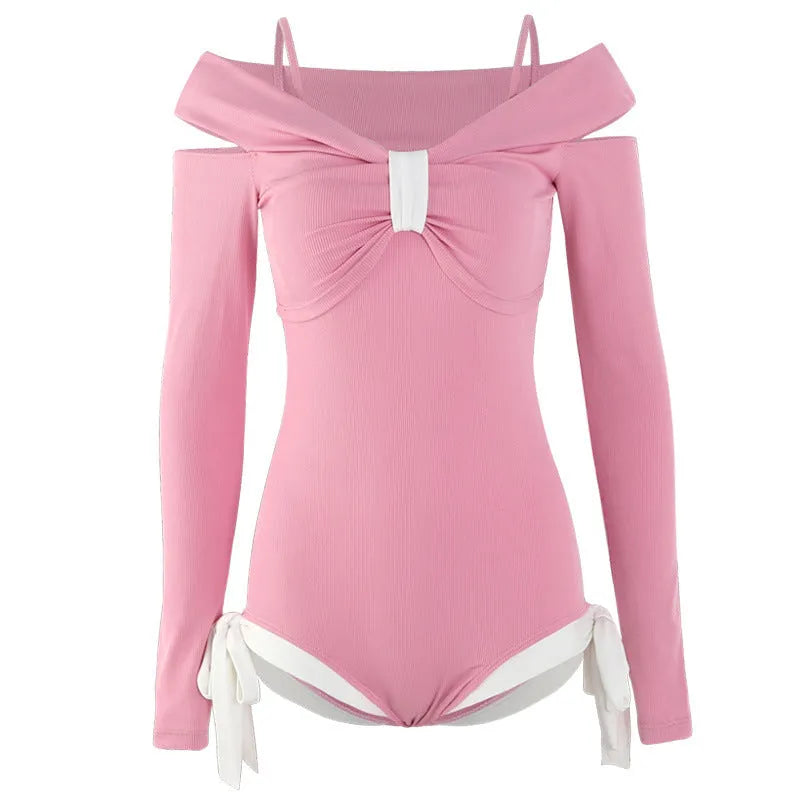 Women's long sleeve one-piece swimsuit in black or pink with figure-flattering design