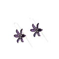 Close-up of a pair of purple alloy flower-shaped earrings with a retro elegant style.