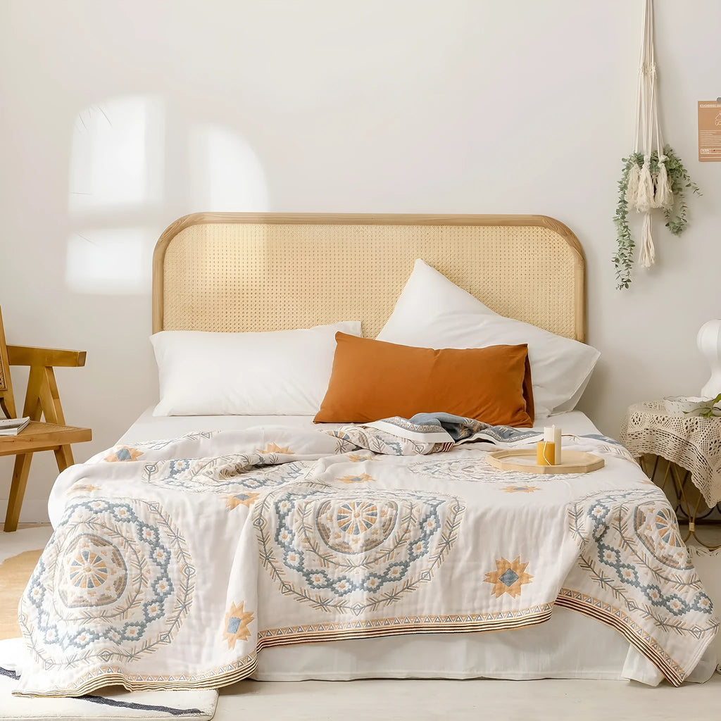 Geometric pattern cotton towel blanket laid flat, showing its textured weave and rectangular shape.