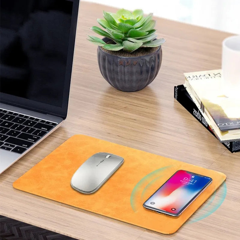 Brown leather-textured wireless charging mouse pad with a smartphone placed on it, showing a Micro USB port on the side.