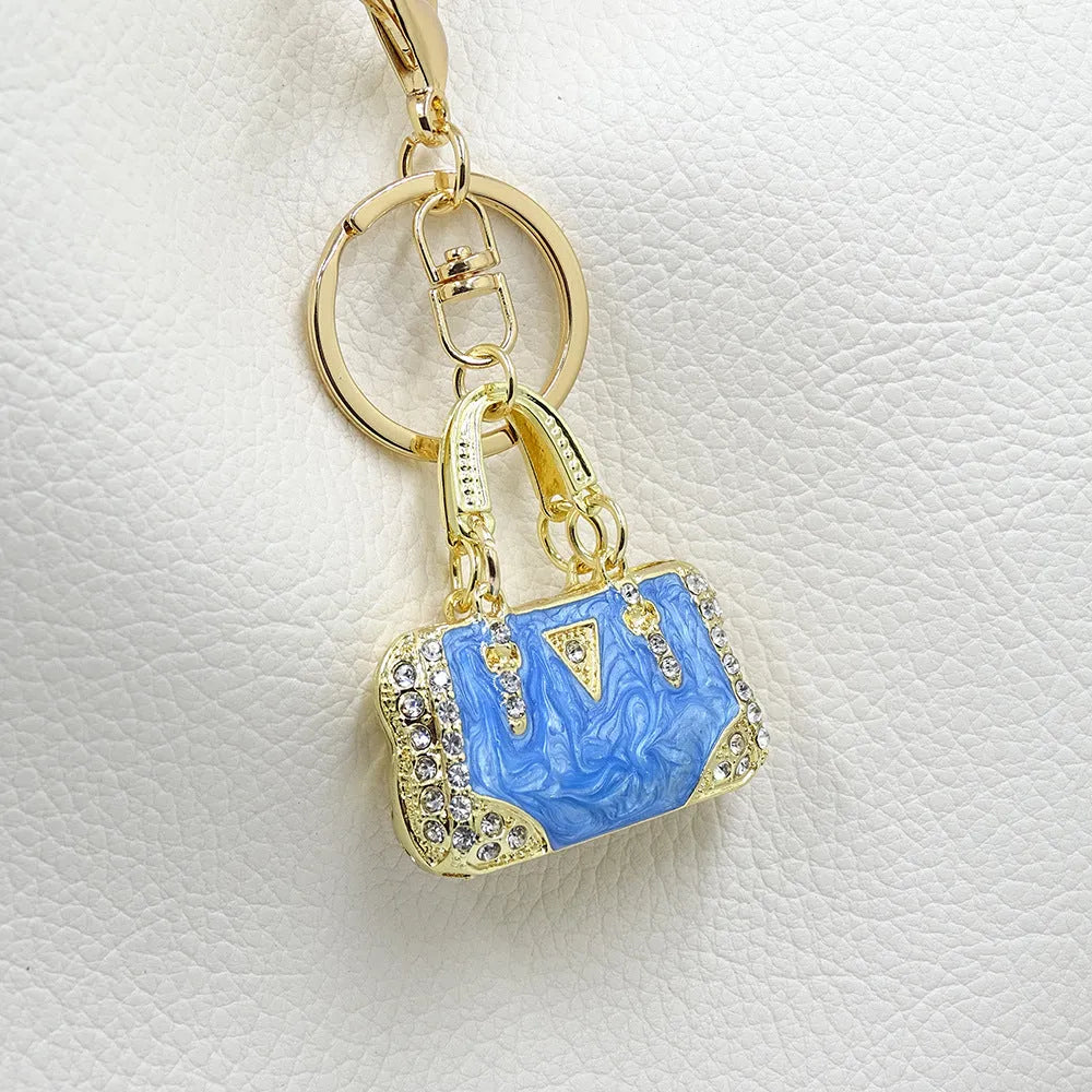 Alloy pendant keychain with enamel diamond cloud pattern in gold colour on keyring