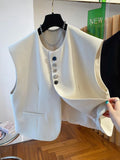 Loose-fitting beige waistcoat dress with bandage styling and pocket detailing