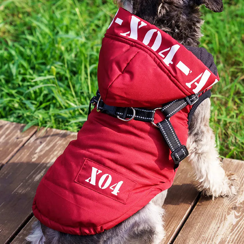 Red fleece-lined waterproof winter jacket for a dog on a grey background, showing hood and casual fit.