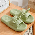 Women's deer horn design flip flop slippers in light yellow on a white background.