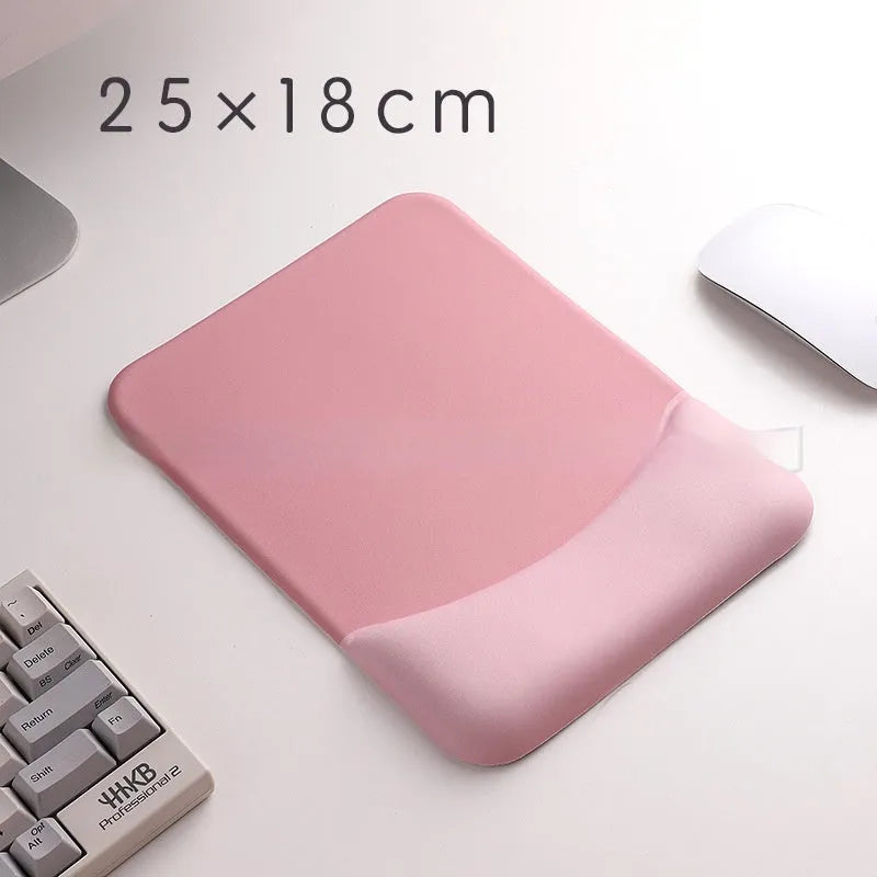 Square black silica gel mouse pad with raised keyboard support area and integrated wrist rest on a wooden desk.