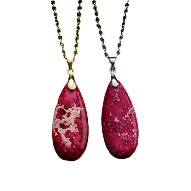 Emperor Stone water drop pendant necklace with genuine jade centre and 18K gold plated setting on a chain.