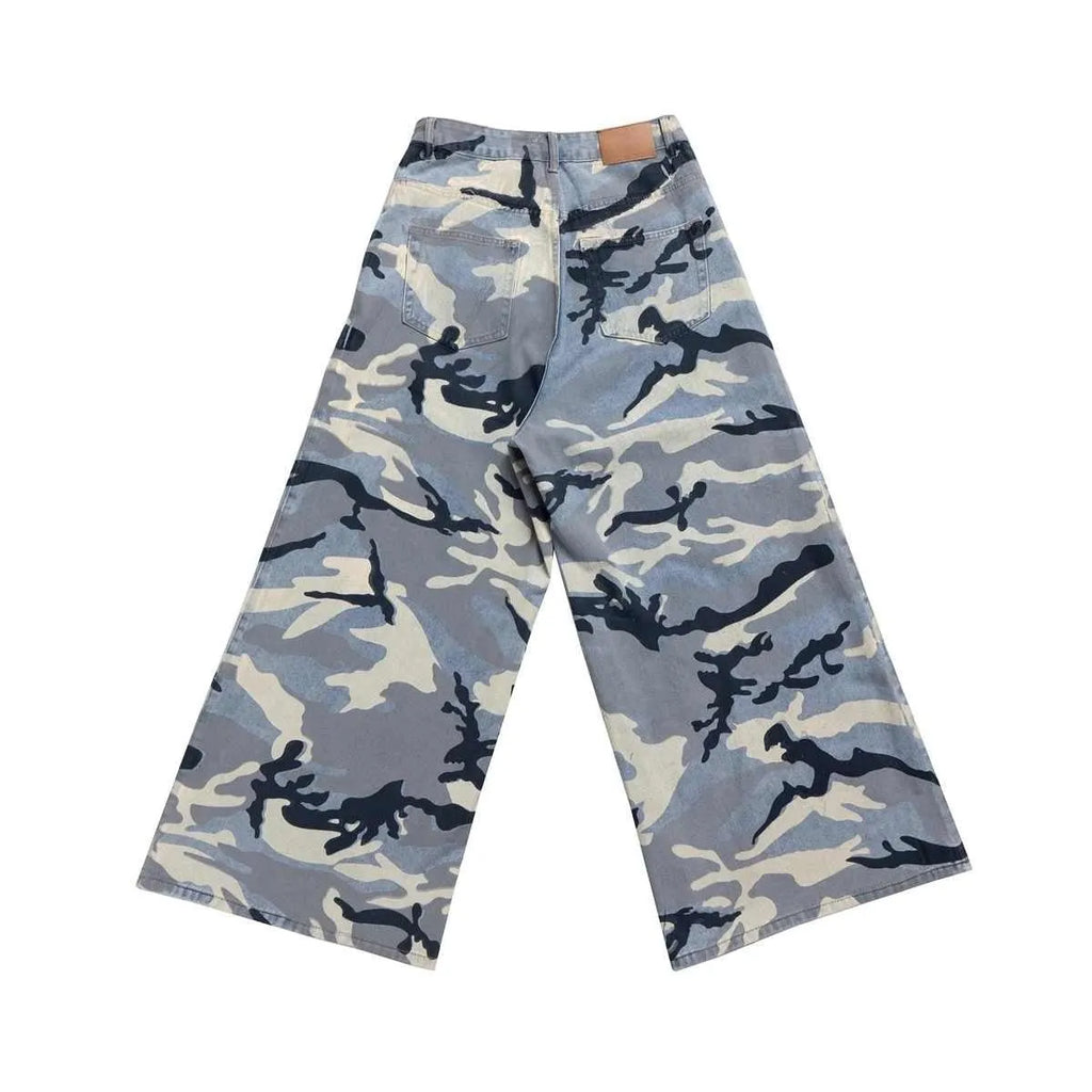 Snow camouflage blue loose fit denim jeans for men and women on a hanger.