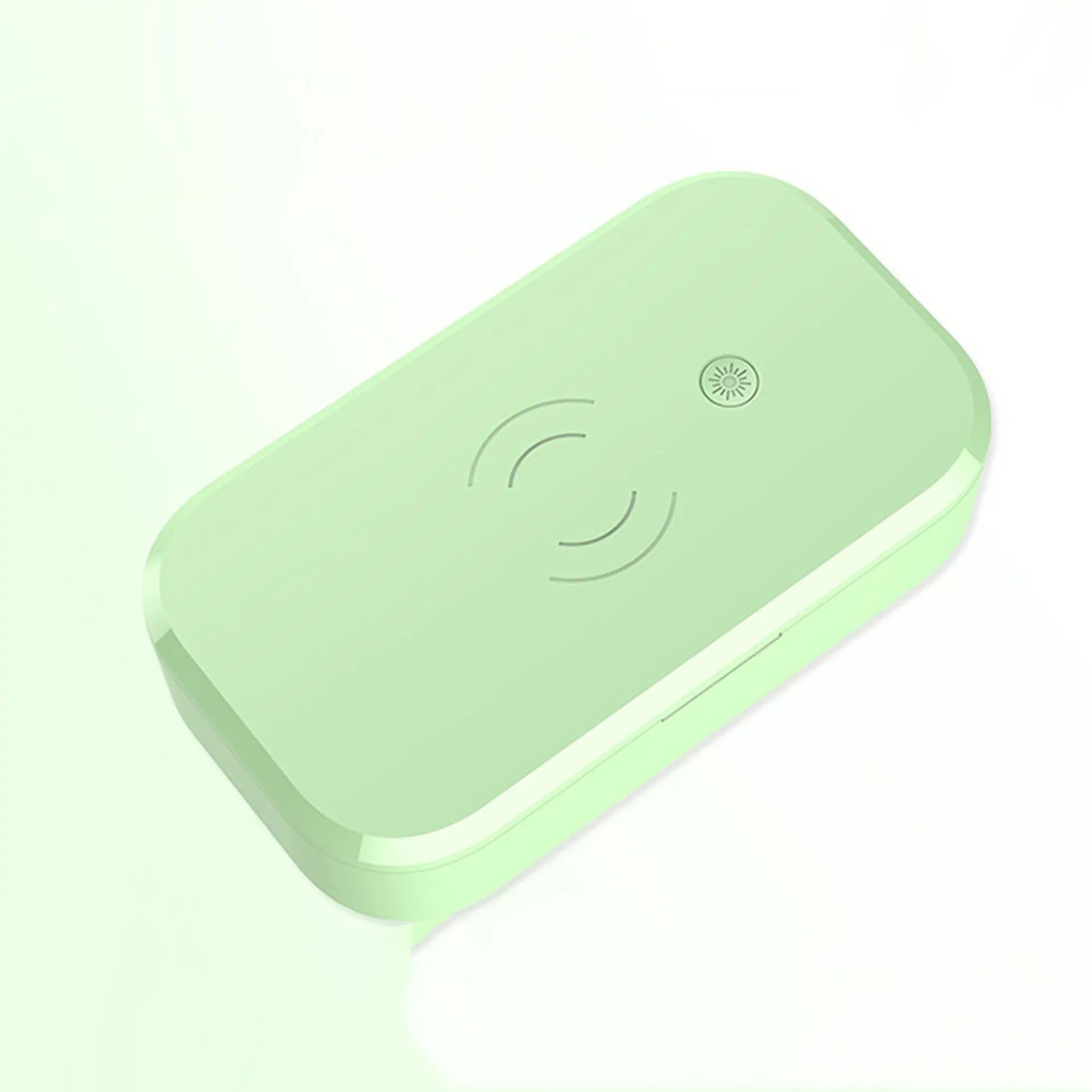 White multifunctional UV disinfection box with wireless charging pad for mobile phones and nail tools.