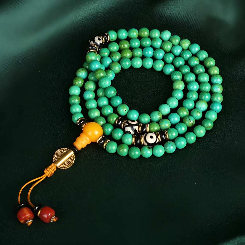 Natural turquoise bracelet with 108 round 8mm beads on a white background.