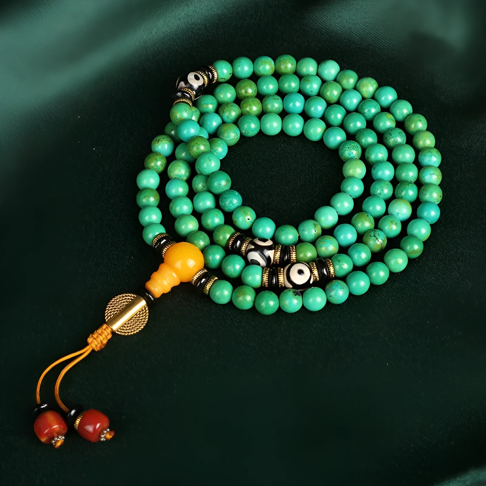 Natural turquoise bracelet with 108 round 8mm beads on a white background.