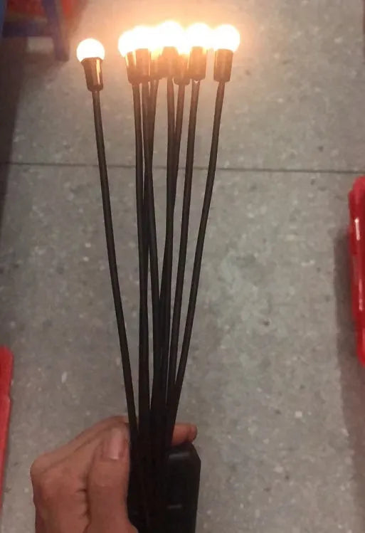 Solar-powered LED firefly ground lamp with multiple light heads for garden pathway illumination