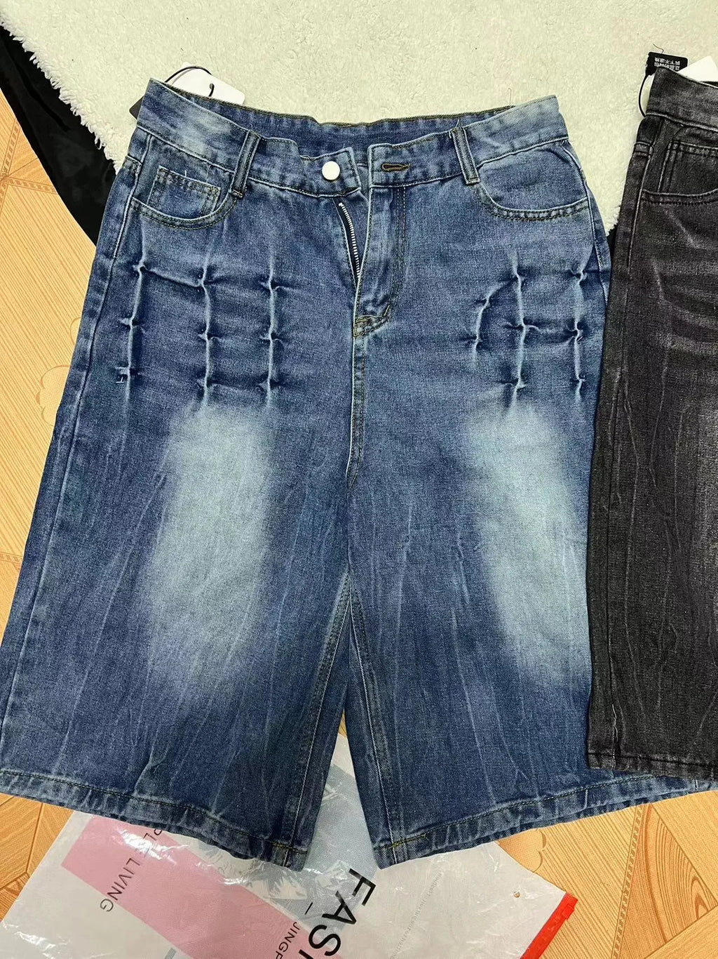 Men's loose fit casual denim shorts in a washed blue colour with a straight leg and mid-rise waist.