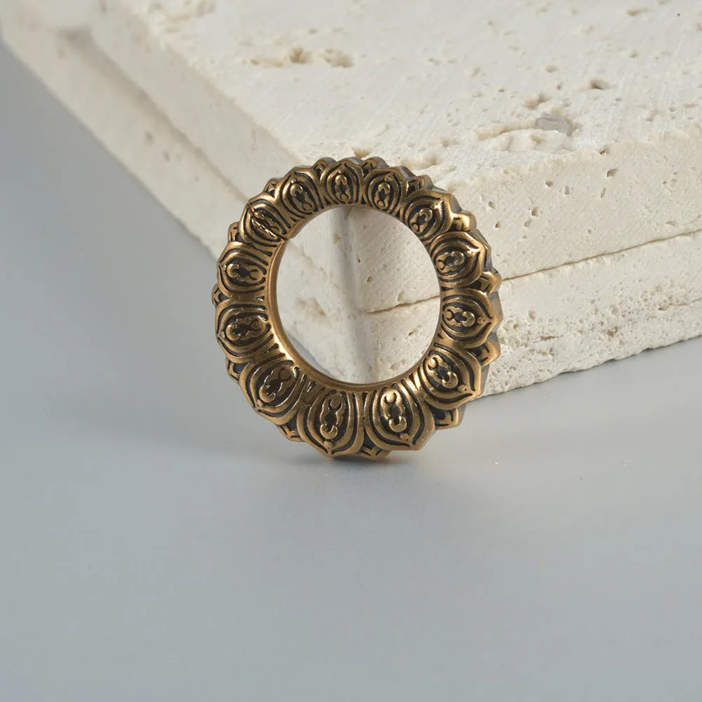 Retro heart-shaped and lotus magnetic earrings in stainless steel with antique finishes